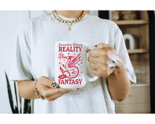Somewhere Between Reality and Fantasy Book Mug: 15 oz